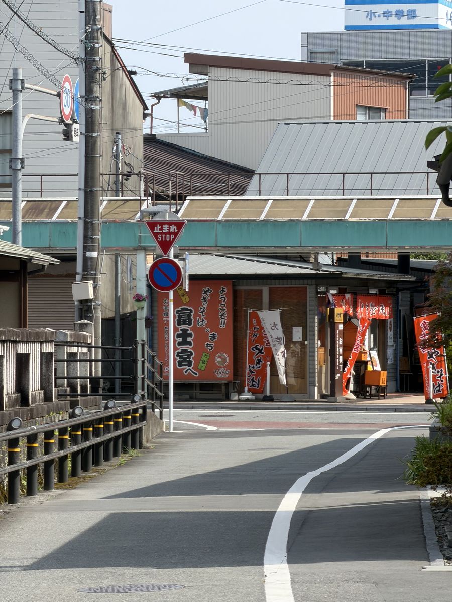Street corner in Fujinomiya lined with orange yakisoba banners