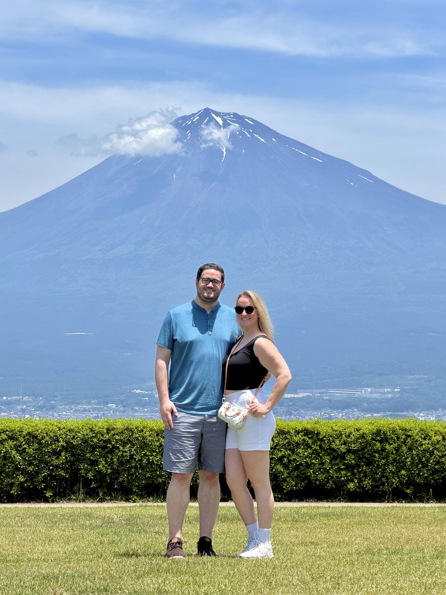 Couple on a lawn with Mt. Fuji