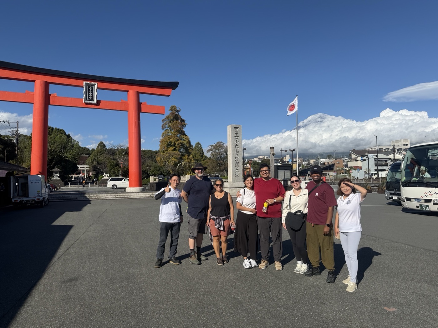 Weekday tour group at the shrine's torii gate with Mt. Fuji