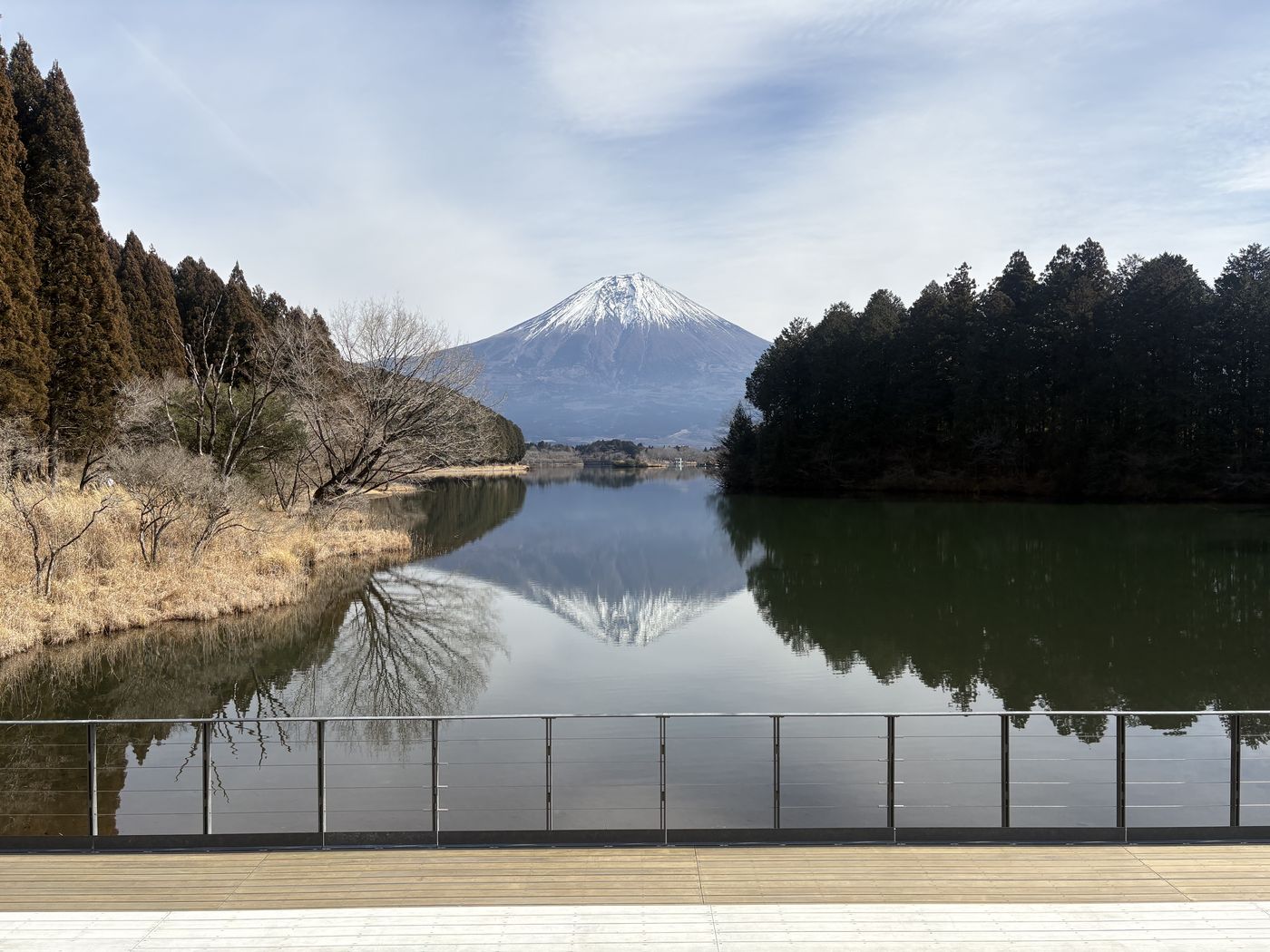 Mt. Fuji mirrored in a still lake on the southern side, with no crowds
